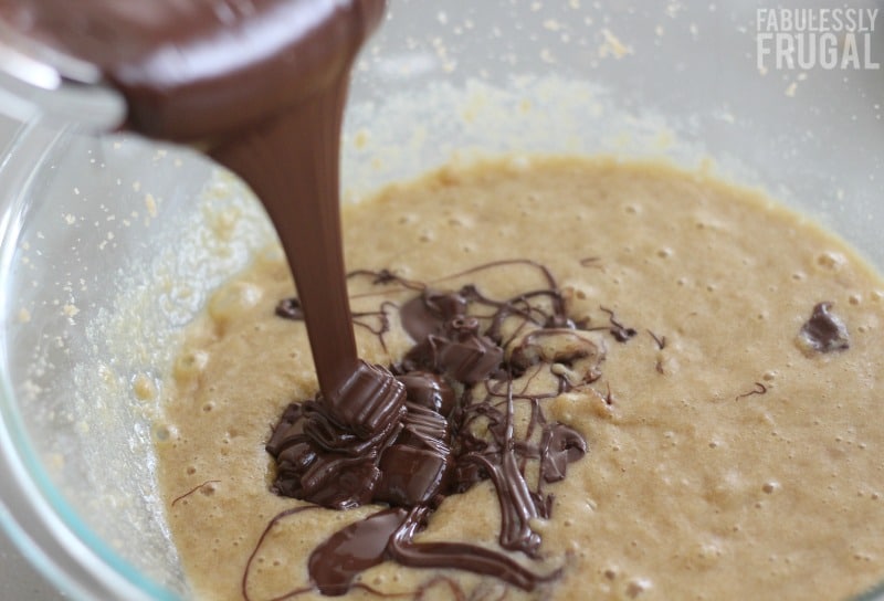 Pouring chocolate into chocolate cookies batter