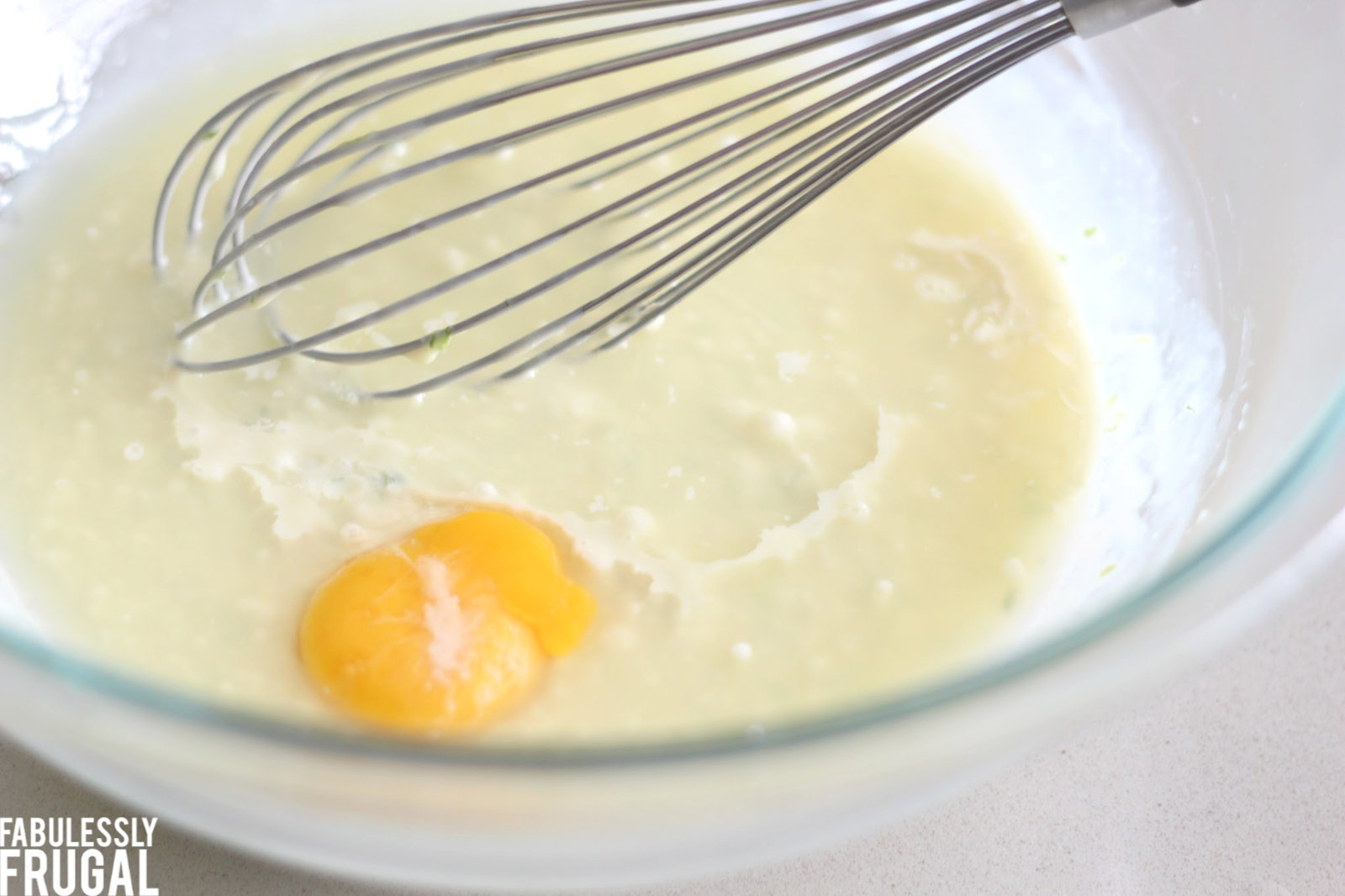 Mixing sweetened condensed milk and egg yolk