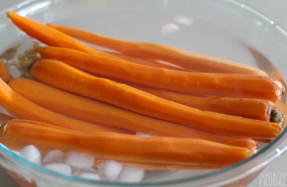 Peeled carrots in ice bath
