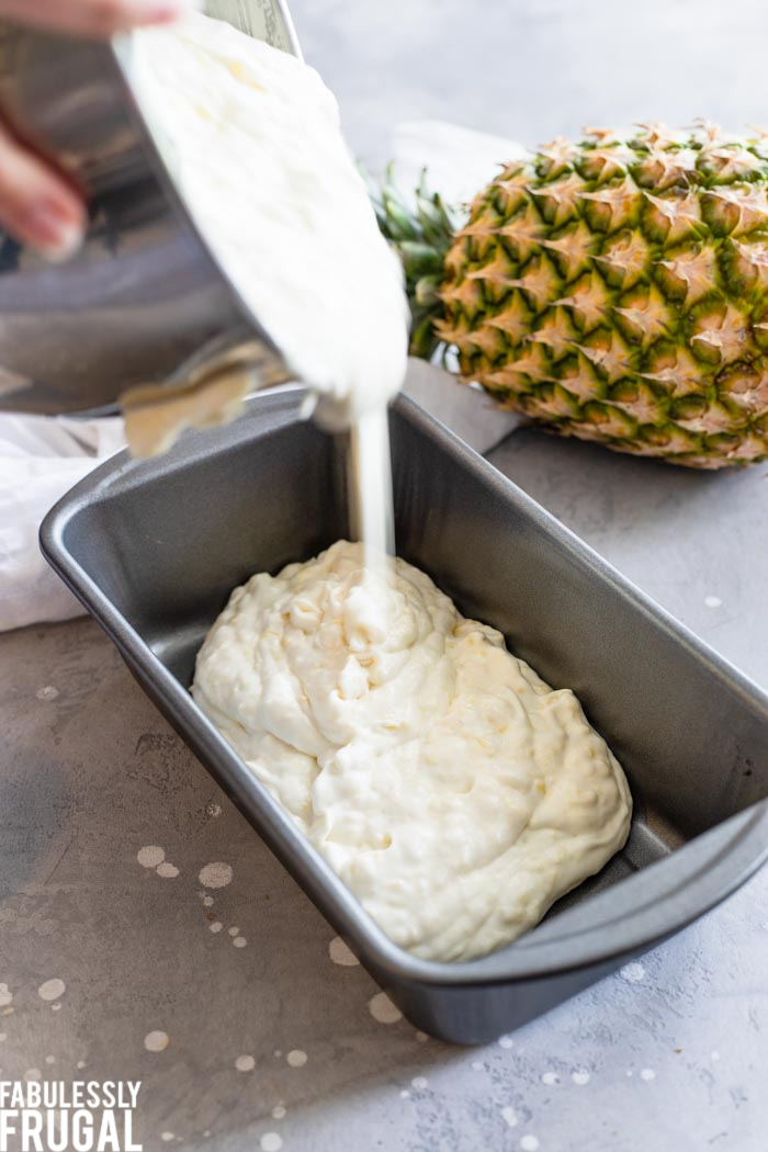 Pouring pineapple ice cream into freezer container