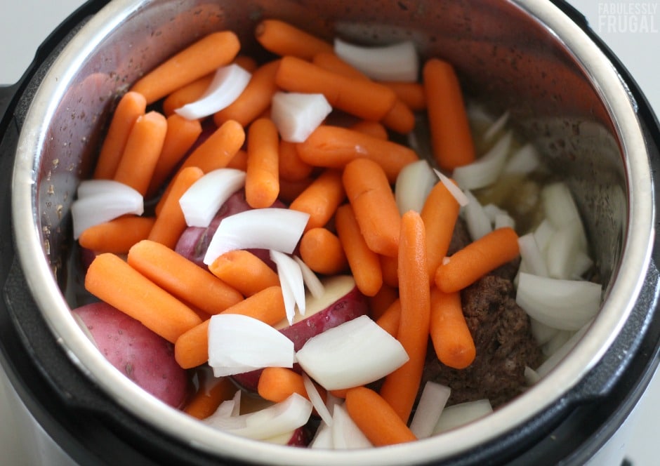 Pot roast in pressure cooker with carrots potatoes
