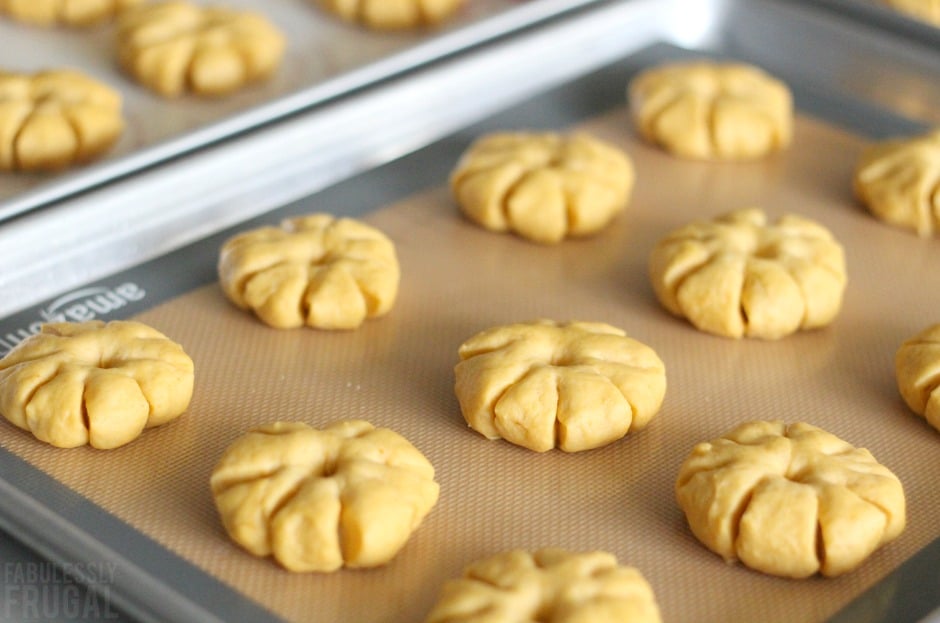 Pumpkin shaped rolls ready to bake