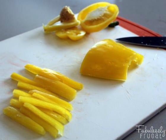 cutting a yellow pepper for crudites