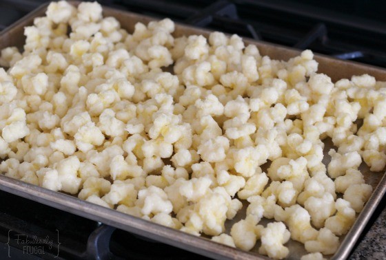 sugared corn pops on the baking sheet