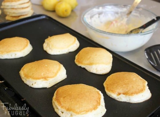 lemon ricotta pancakes on the griddle