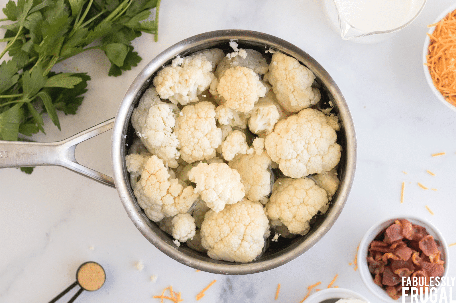 Cauliflower florets in pot ready to boil