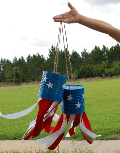 Two tin can windsocks in red white and blue with stars