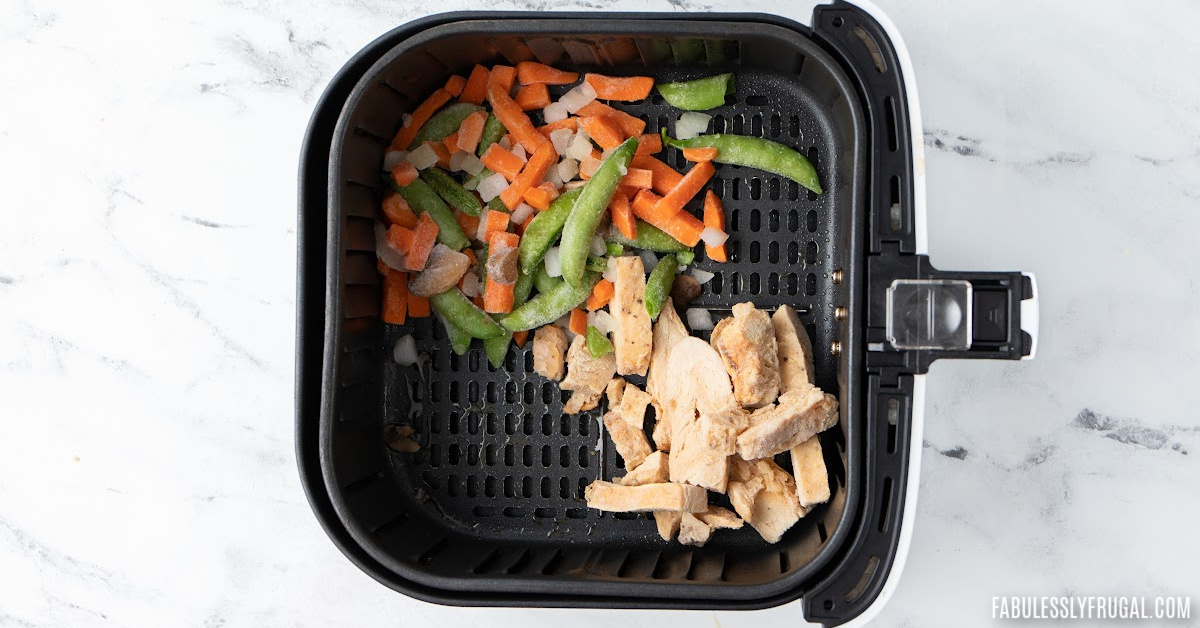 vegetables and chicken in air fryer basket