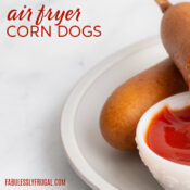 air fryer frozen corn dogs with ketchup on a plate
