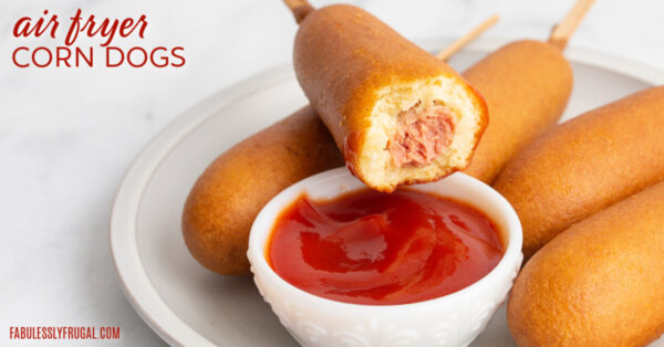 air fryer frozen corn dogs with ketchup on a plate