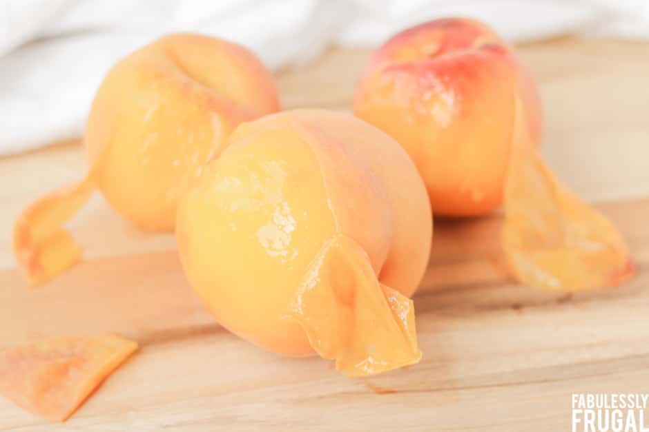 Peeling skin off peaches