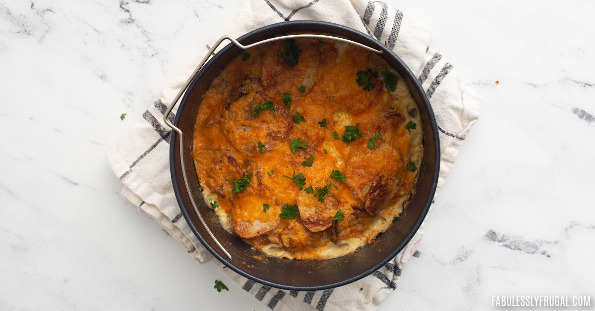 scalloped potatoes in a cake barrel dish