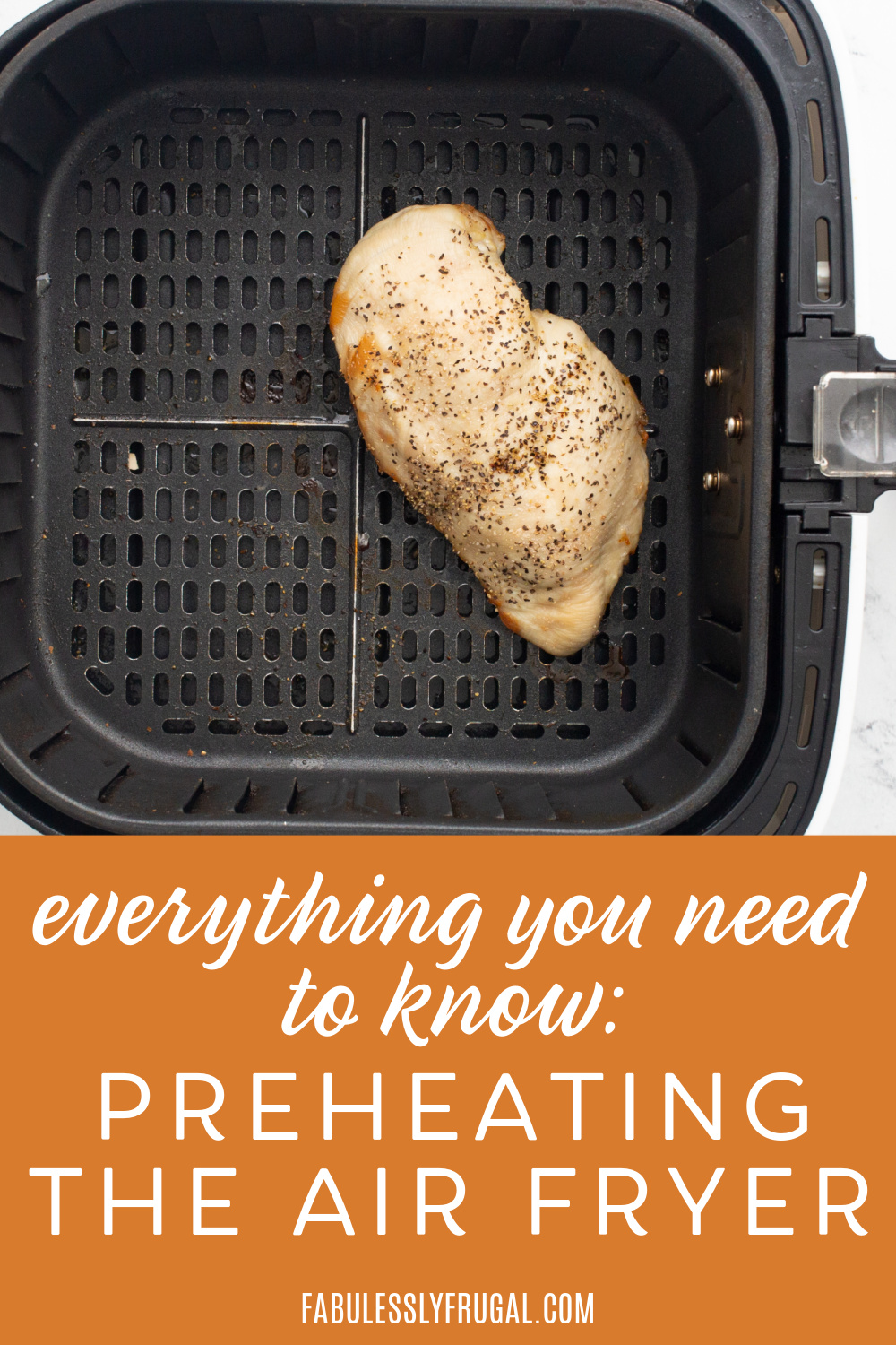 everything you need to know: preheating the air fryer text with cooked chicken breast in air fryer