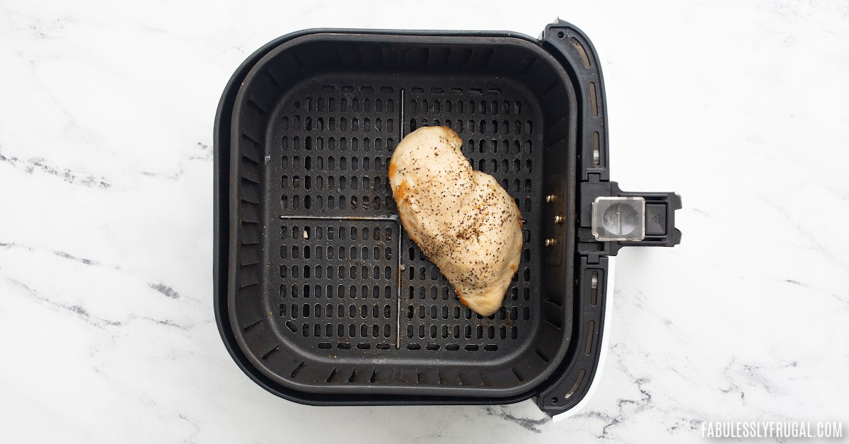 cooked chicken breast in air fryer basket