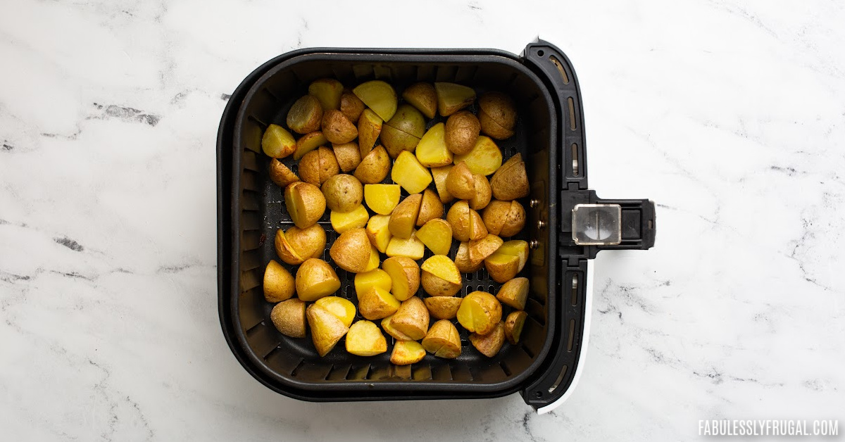 cubed potatoes in the air fryer basket