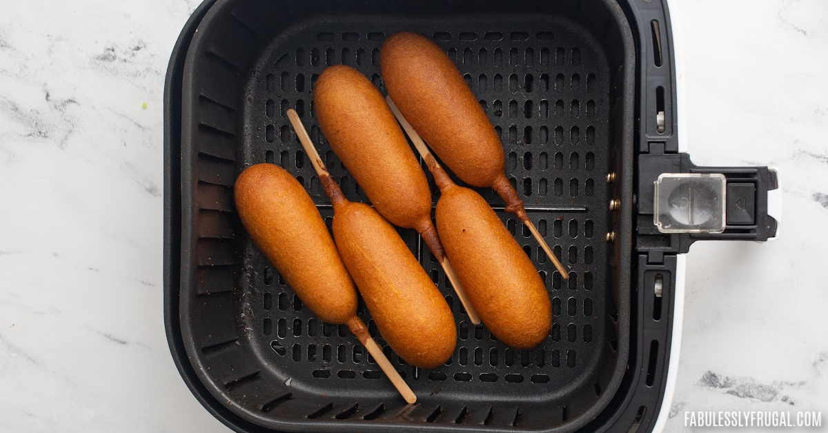 cooked corn dogs in air fryer basket