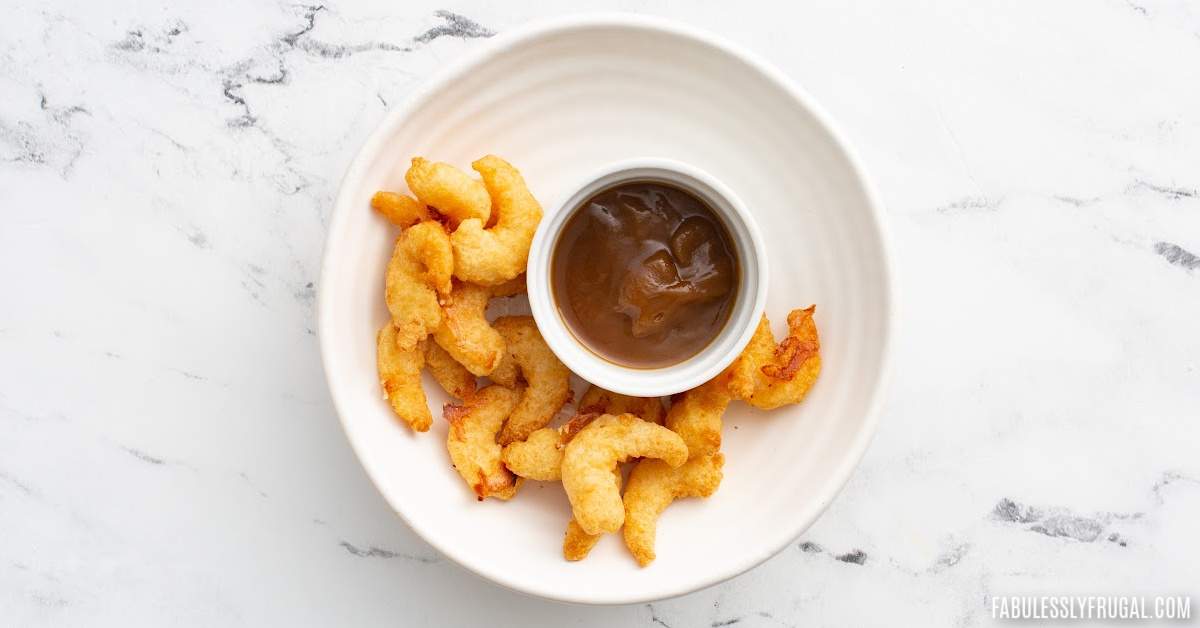 tempura shrimp air fried on plate with bbq dipping sauce 