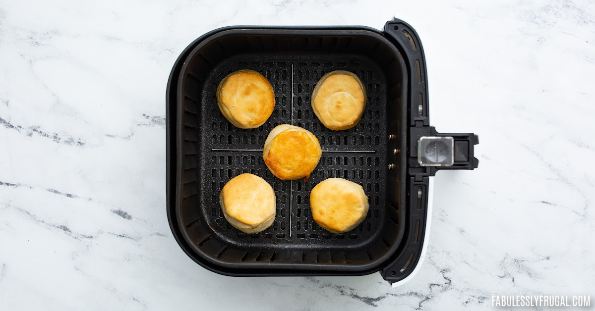 cooked canned biscuit circles in the air fryer basket
