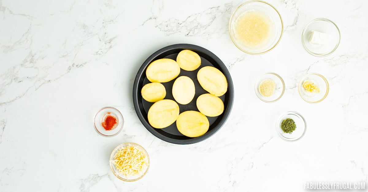 halved potatoes in air fryer dish