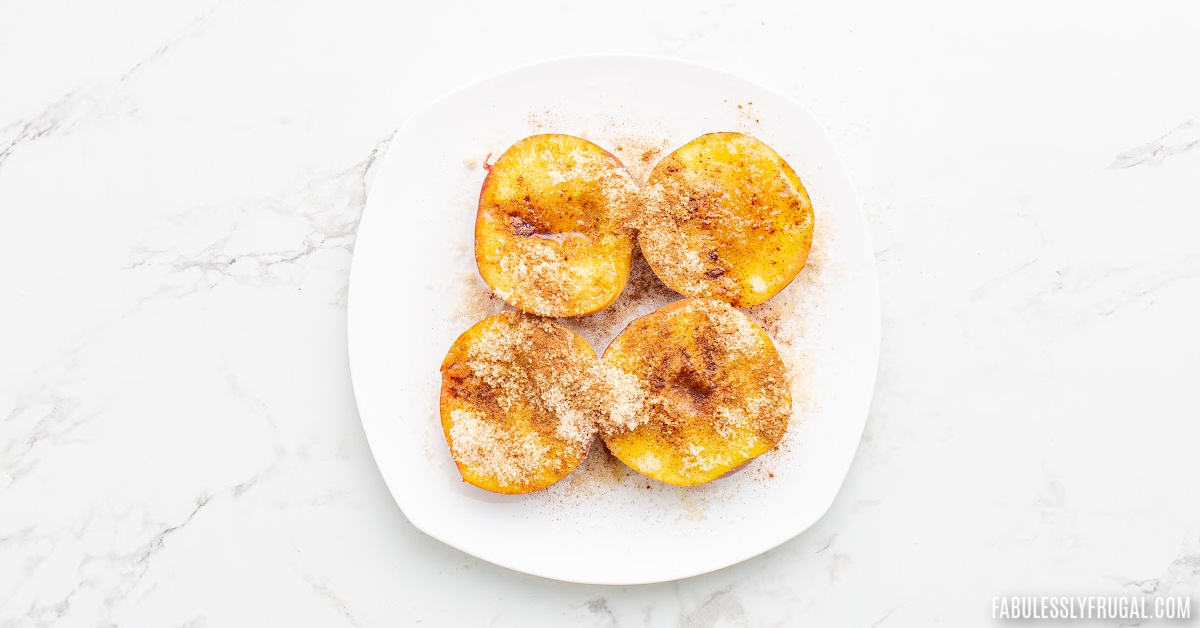peaches cut in half with topping ingredients