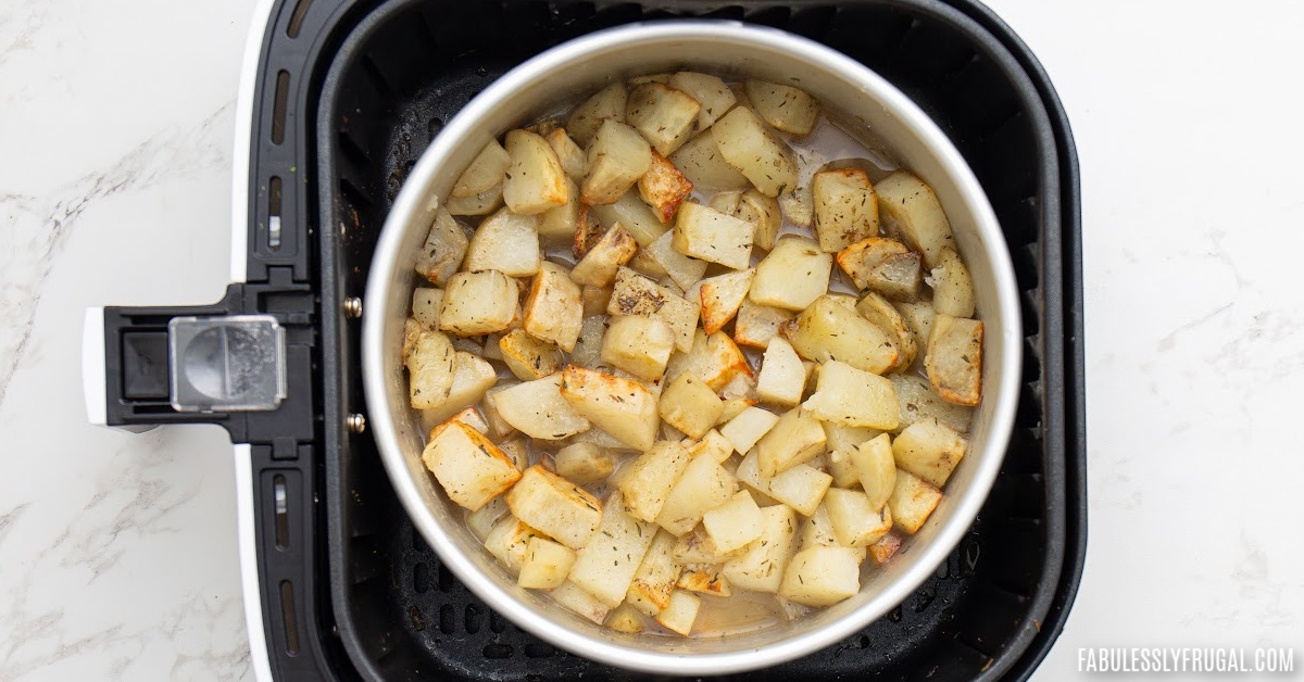 potatoes in bowl in air fryer basket