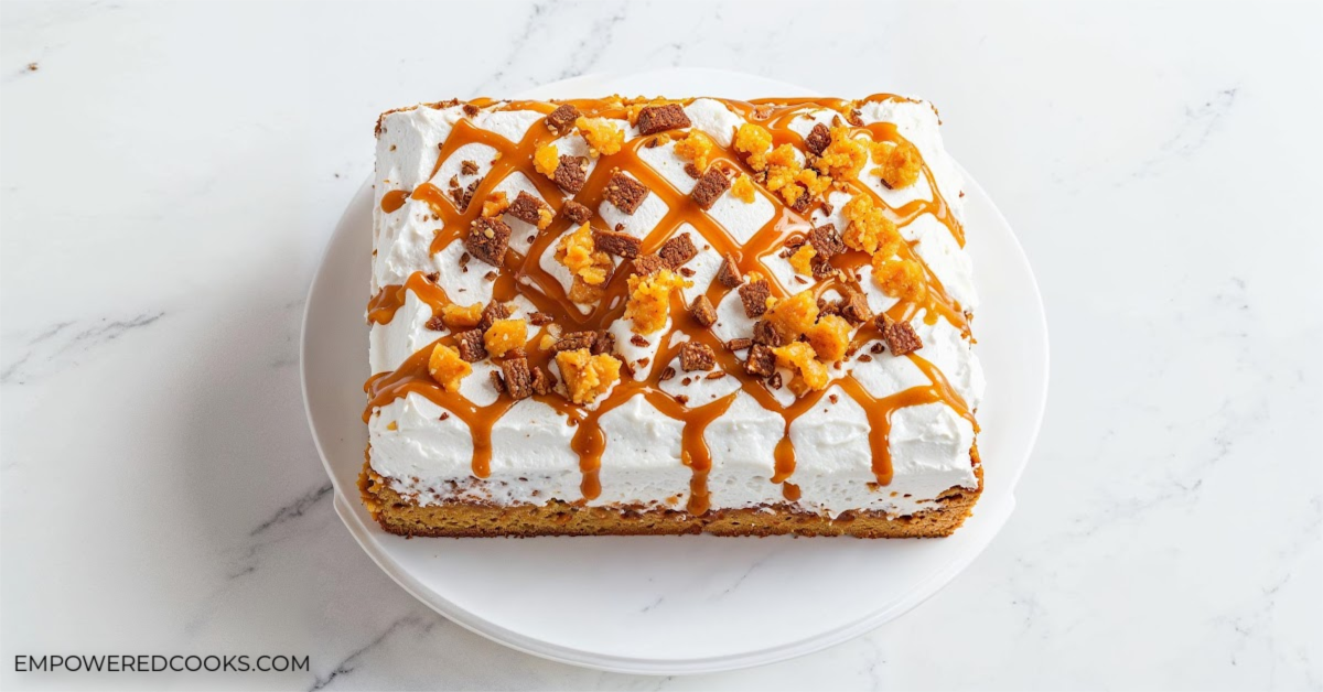 pumpkin poke cake with caramel and toffee topping