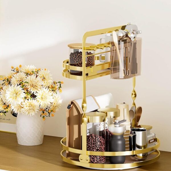 Gold two-tier rotating makeup organizer with brush holder and jewelry hooks